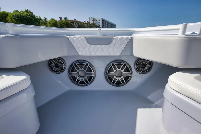 Slide: The Image of 2025 Contender 44 ST boat interior with modern speaker system and sleek seating design. - 9