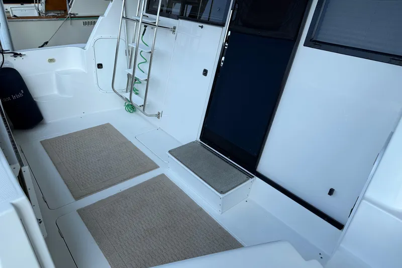 Slide: The Image of 1999 Bayliner 3988 Command Bridge Motoryacht docked in a marina under clear skies. - 1