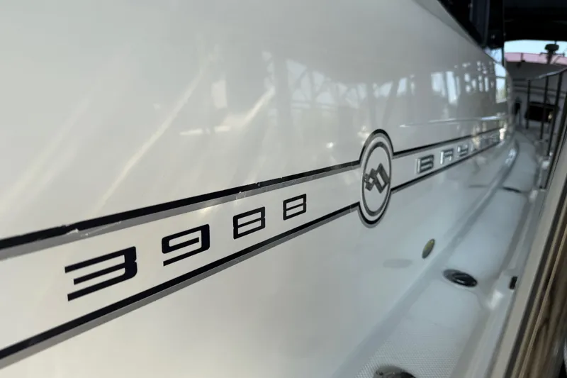 Slide: The Image of 1999 Bayliner 3988 Command Bridge Motoryacht side view with model branding. - 100