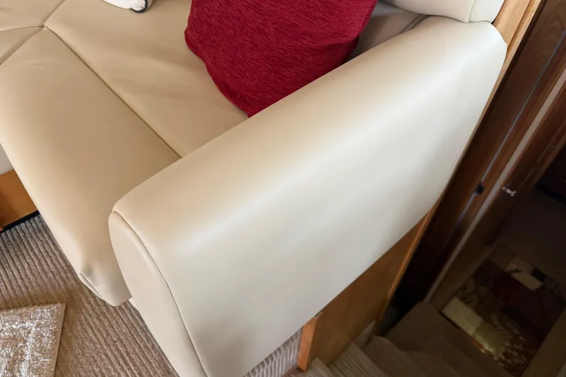 Slide: The Image of Interior of 1999 Bayliner 3988 yacht with blinds, coffee maker, and wooden cabinetry. - 11