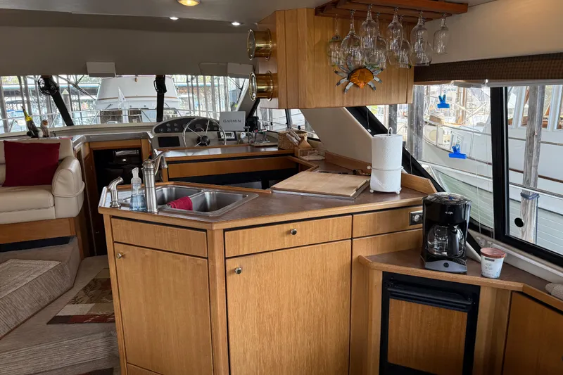 Slide: The Image of Interior of 1999 Bayliner 3988 yacht with blinds and ceiling light. - 12