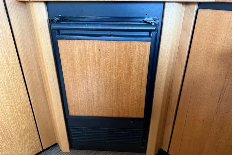 Slide: The Image of Luxurious interior of 1999 Bayliner 3988 Command Bridge Motoryacht with beige leather seating. - 13