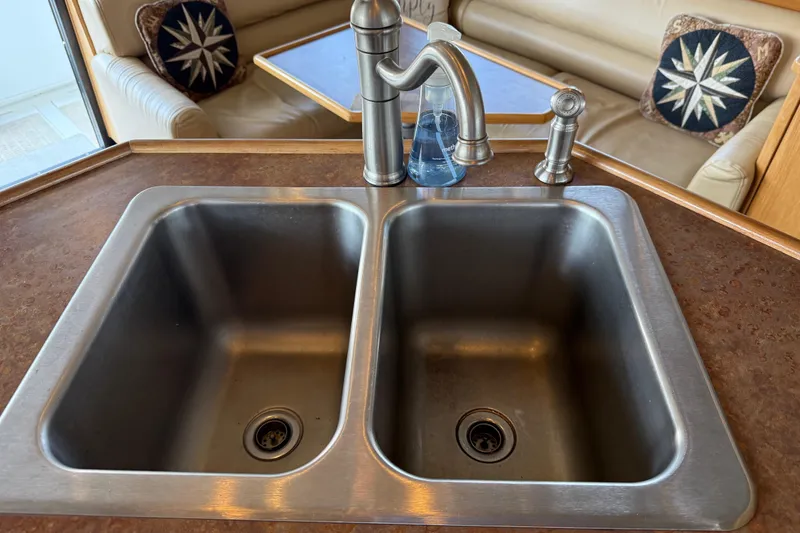 Slide: The Image of Open fridge on 1999 Bayliner 3988 yacht, stocked with drinks and condiments. - 22