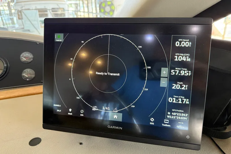 Slide: The Image of 1999 Bayliner 3988 Command Bridge Motoryacht helm with steering wheel and control panel. - 27
