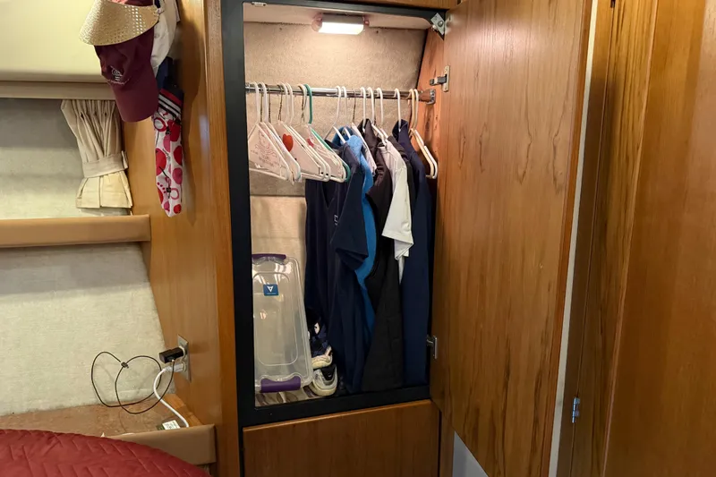 Slide: The Image of Interior of 1999 Bayliner 3988 Command Bridge Motoryacht with map and wooden cabinetry. - 38