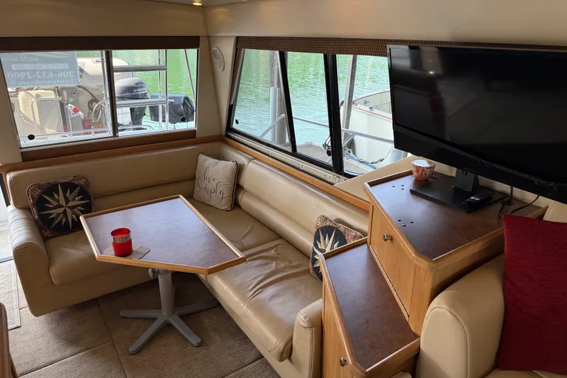 Slide: The Image of 1999 Bayliner 3988 Command Bridge Motoryacht deck with mats and ladder. - 4