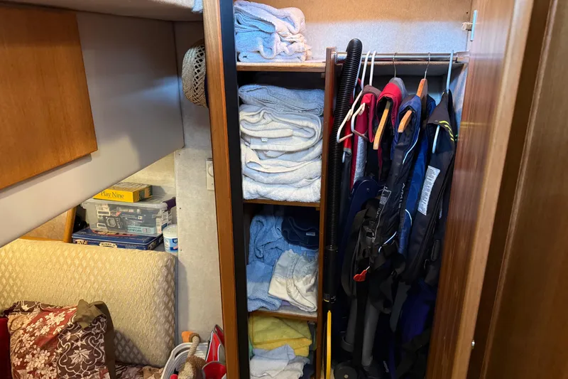 Slide: The Image of Interior of 1999 Bayliner 3988 Command Bridge Motoryacht with wooden doors and carpeted stairs. - 47