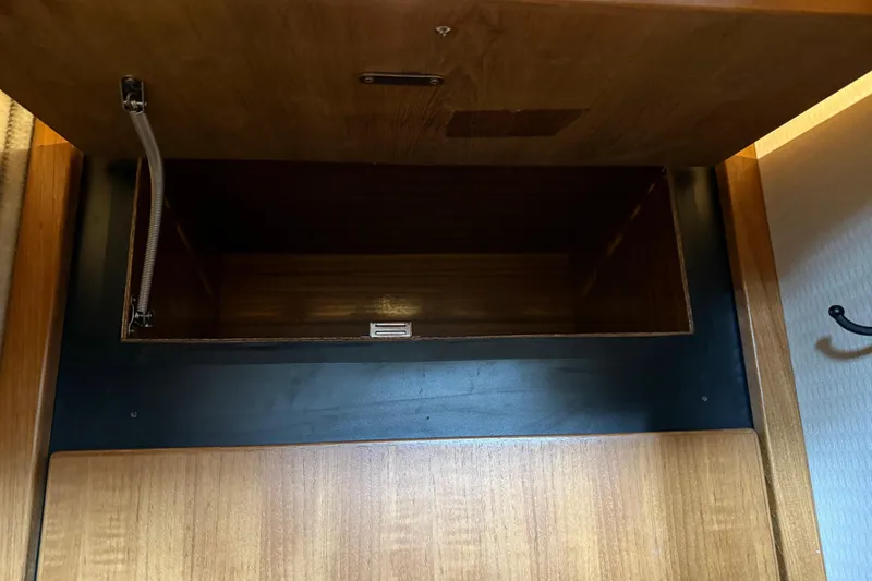 Slide: The Image of 1999 Bayliner 3988 Command Bridge Motoryacht interior with cozy cabin and decorative pillows. - 48