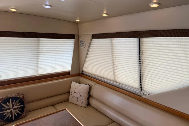 Slide: The Image of Interior of 1999 Bayliner 3988 Command Bridge Motoryacht with cozy seating and modern amenities. - 5
