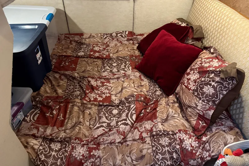 Slide: The Image of Open wooden storage compartment on 1999 Bayliner 3988 Command Bridge Motoryacht. - 51