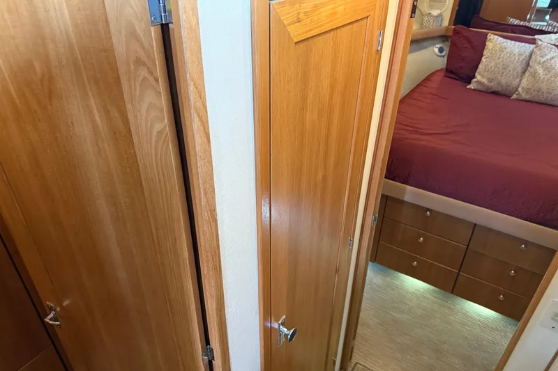 Slide: The Image of Interior view of 1999 Bayliner 3988 Command Bridge Motoryacht with wooden doors and cozy cabin. - 55