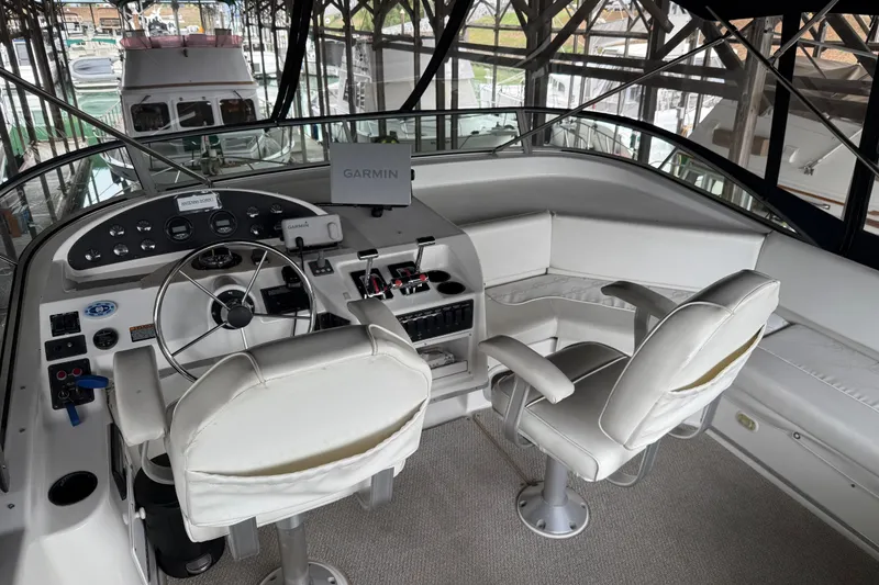 Slide: The Image of Interior of 1999 Bayliner 3988 Command Bridge Motoryacht with wooden doors and cozy bedroom. - 58