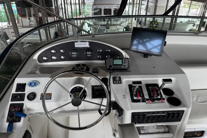 Slide: The Image of Bathroom interior of 1999 Bayliner 3988 Command Bridge Motoryacht with towels and wooden door. - 60