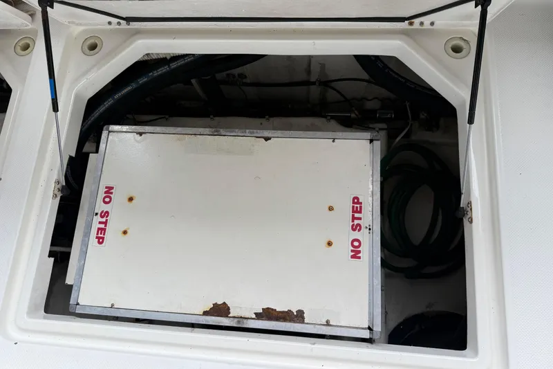 Slide: The Image of 1999 Bayliner 3988 Command Bridge Motoryacht control panel with throttle levers and navigation equipment. - 68