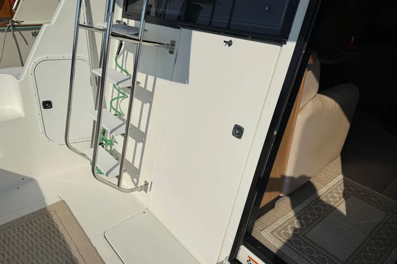 Slide: The Image of 1999 Bayliner 3988 Command Bridge Motoryacht interior view with water backdrop. - 70