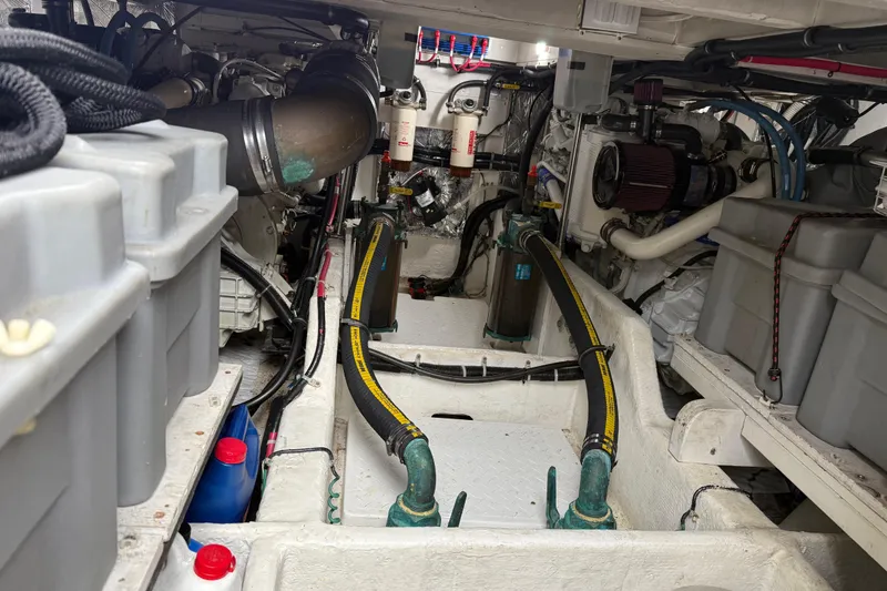 Slide: The Image of 1999 Bayliner 3988 Command Bridge Motoryacht engine compartment with "No Step" warning. - 71