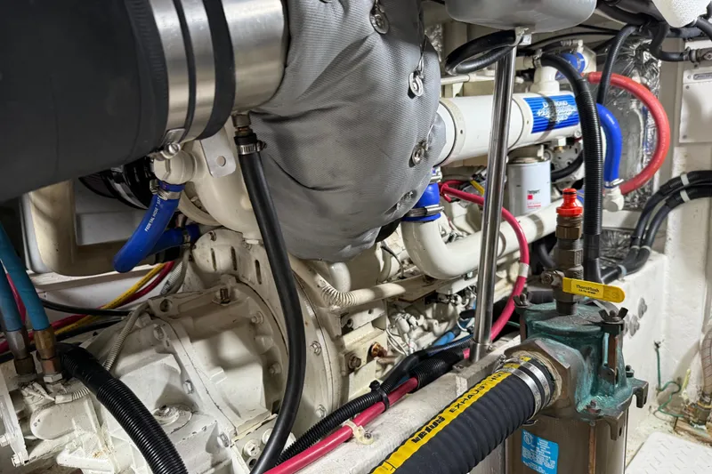 Slide: The Image of Engine compartment of 1999 Bayliner 3988 Command Bridge Motoryacht, showing battery and wiring. - 72