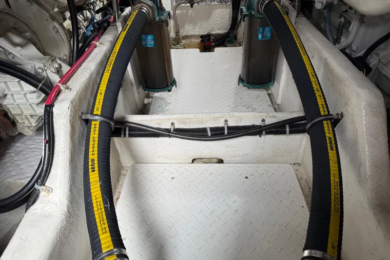 Slide: The Image of Engine room of 1999 Bayliner 3988 Command Bridge Motoryacht, showcasing mechanical components. - 74