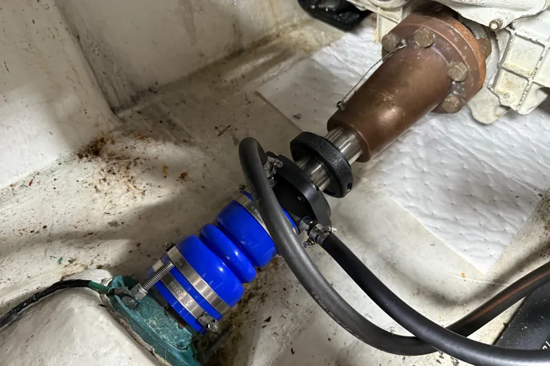 Slide: The Image of Engine room of 1999 Bayliner 3988 Command Bridge Motoryacht with visible components and wiring. - 76