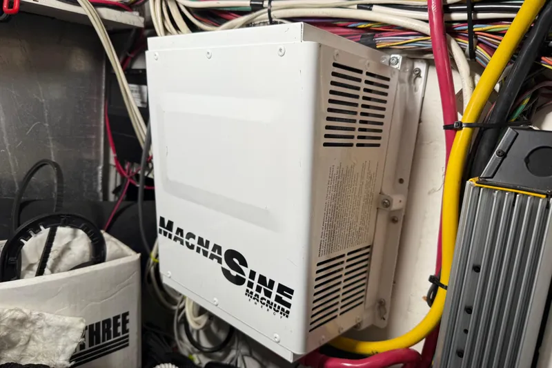 Slide: The Image of Engine compartment of 1999 Bayliner 3988 Command Bridge Motoryacht with exhaust hoses and components. - 77