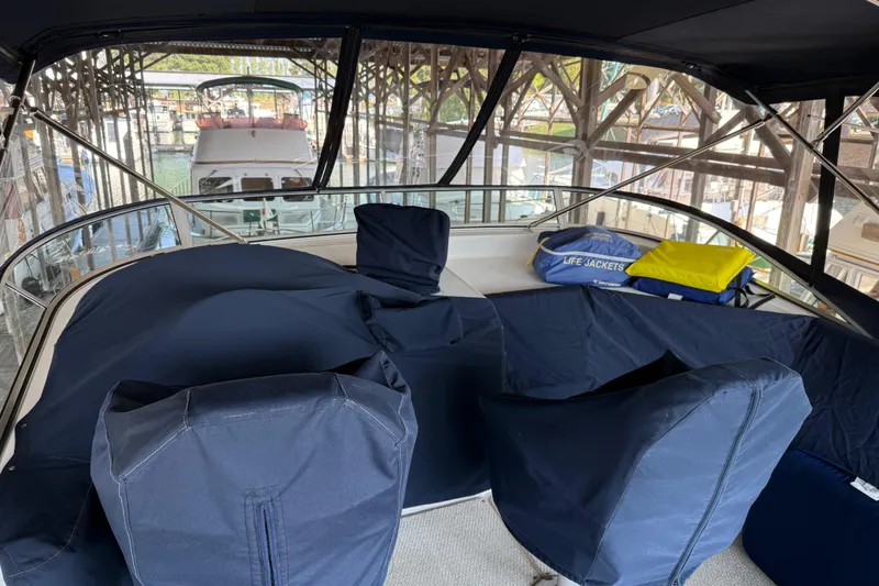 Slide: The Image of 1999 Bayliner 3988 Command Bridge Motoryacht with inflatable dinghy and outboard motor. - 87