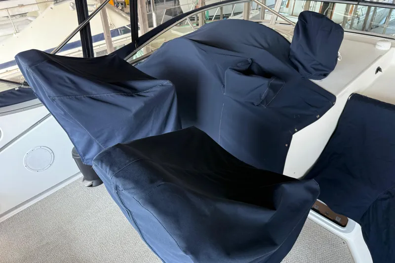 Slide: The Image of 1999 Bayliner 3988 Command Bridge Motoryacht interior detail with foldable table and carpeted floor. - 88