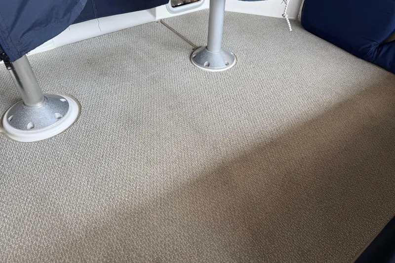 Slide: The Image of 1999 Bayliner 3988 Command Bridge Motoryacht interior with covered seating and life jackets. - 90