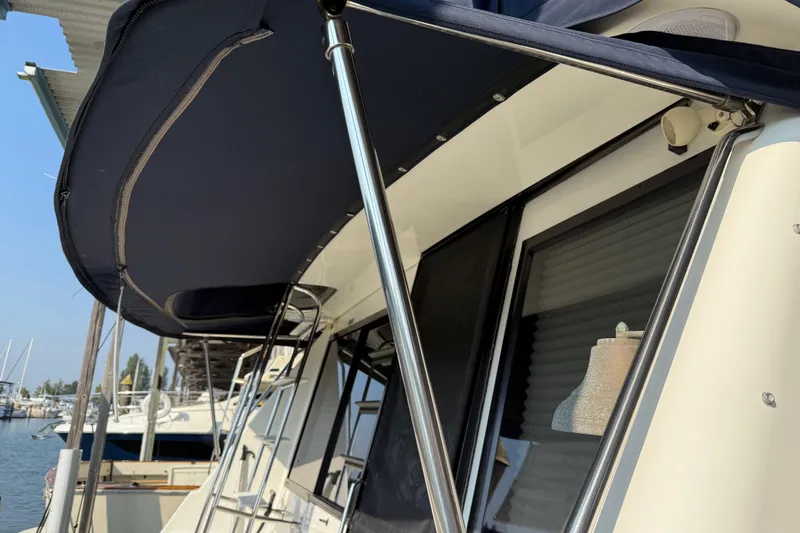 Slide: The Image of View from inside a 1999 Bayliner 3988 Command Bridge Motoryacht overlooking a marina. - 92