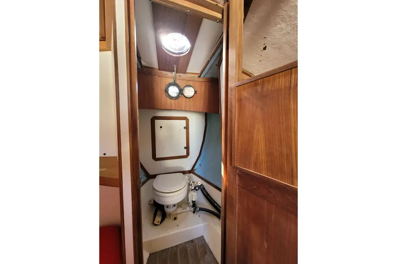 Slide: The Image of Interior of 1983 Atlantic City Kitty Kat 21 boat bathroom with wooden paneling. - 11