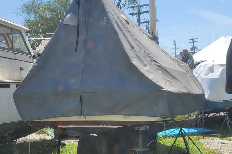 Slide: The Image of Covered 1983 Atlantic City Kitty Kat 21 sailboat in storage yard. - 13