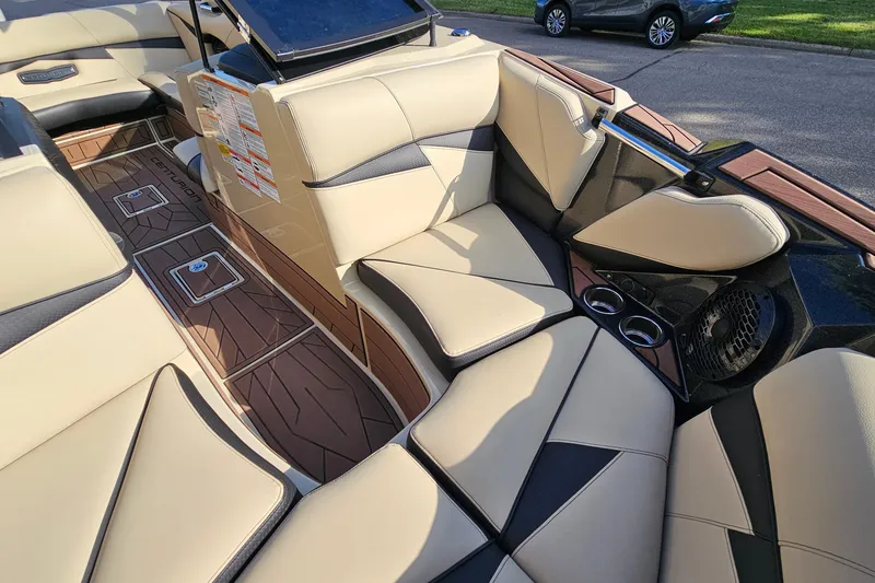 Slide: The Image of Luxurious interior of 2021 Centurion Fi21 boat with beige and black seating. - 16