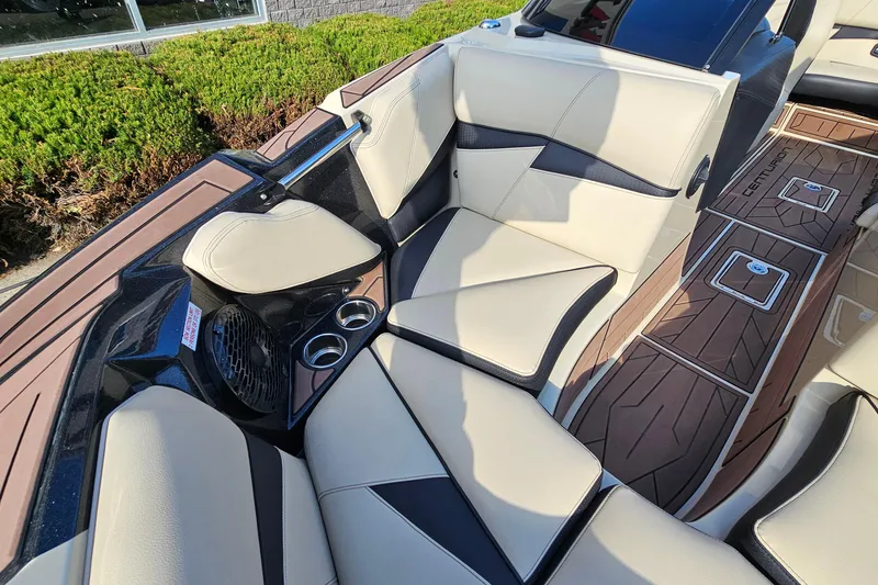 Slide: The Image of Luxurious interior of 2021 Centurion Fi21 boat with beige seating and cup holders. - 17