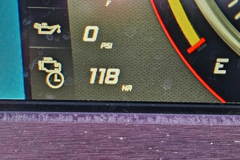 Slide: The Image of Dashboard display of a 2021 Centurion Fi21 showing 118 engine hours. - 21