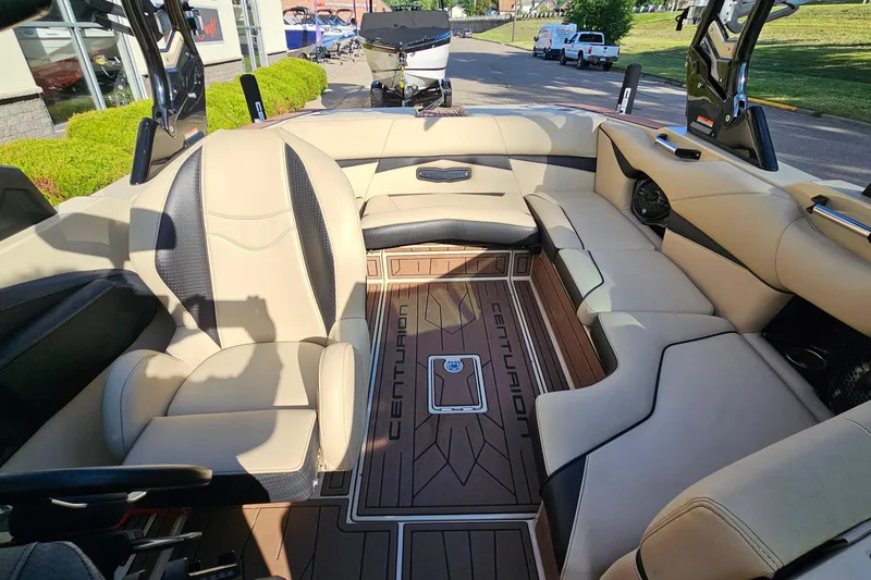 Slide: The Image of Interior of 2021 Centurion Fi21 boat with beige seating and branded flooring. - 8