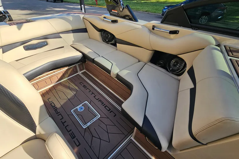 Slide: The Image of Luxurious interior of 2021 Centurion Fi21 boat with beige seating and branded flooring. - 9