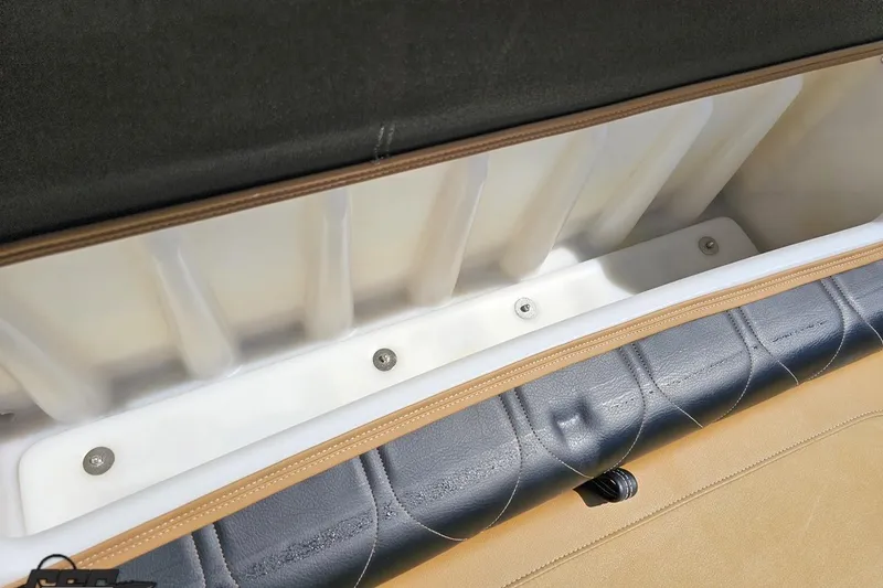 Slide: The Image of 2021 Regency 230 LE3 boat storage compartment with cushioned seating. - 104