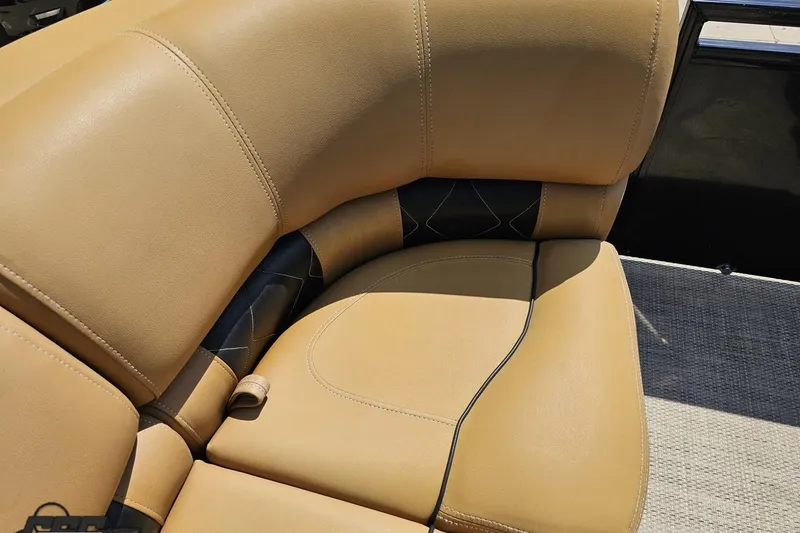 Slide: The Image of 2021 Regency 230 LE3 boat interior with tan leather seating. - 107