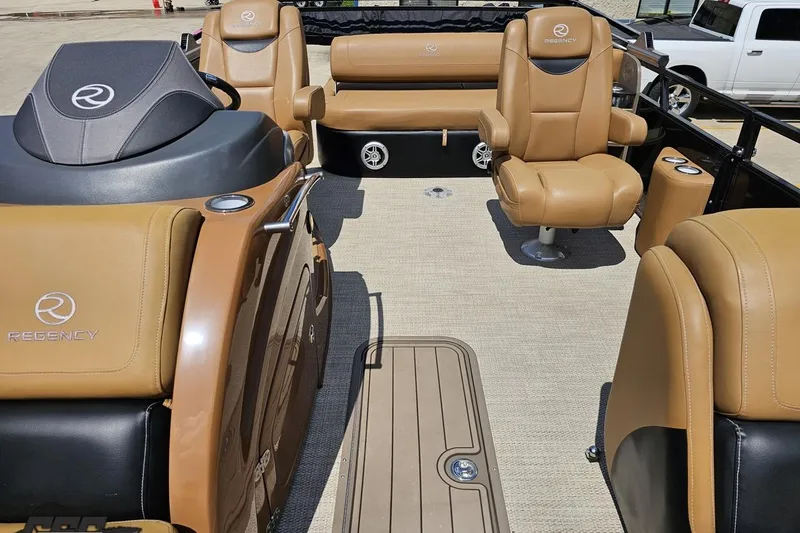 Slide: The Image of 2021 Regency 230 LE3 boat interior with tan leather seating and modern design. - 113