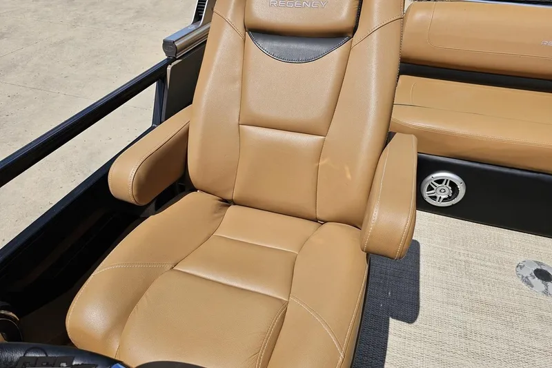 Slide: The Image of Luxurious tan leather seat in 2021 Regency 230 LE3 boat interior. - 116