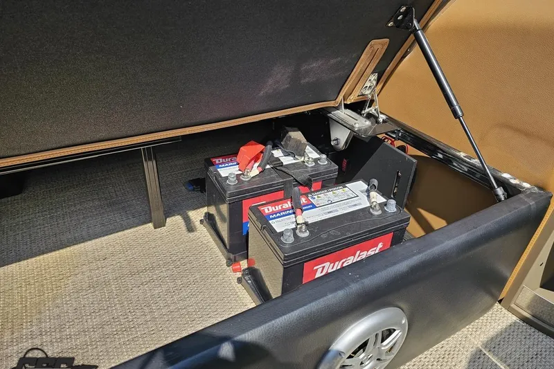 Slide: The Image of Batteries in storage compartment of 2021 Regency 230 LE3 boat. - 119