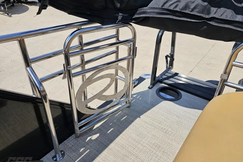 Slide: The Image of 2021 Regency 230 LE3 boat with chrome railing and logo detail. - 122