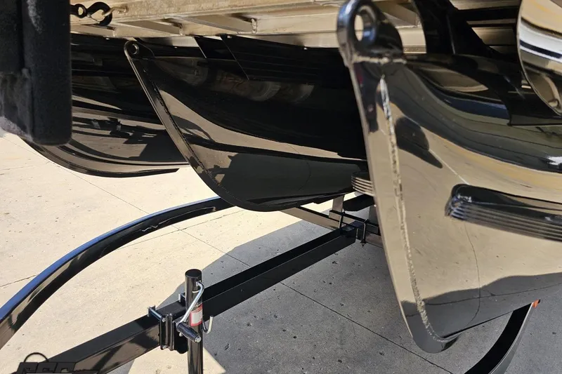 Slide: The Image of Close-up of 2021 Regency 230 LE3 boat hull and trailer components. - 24