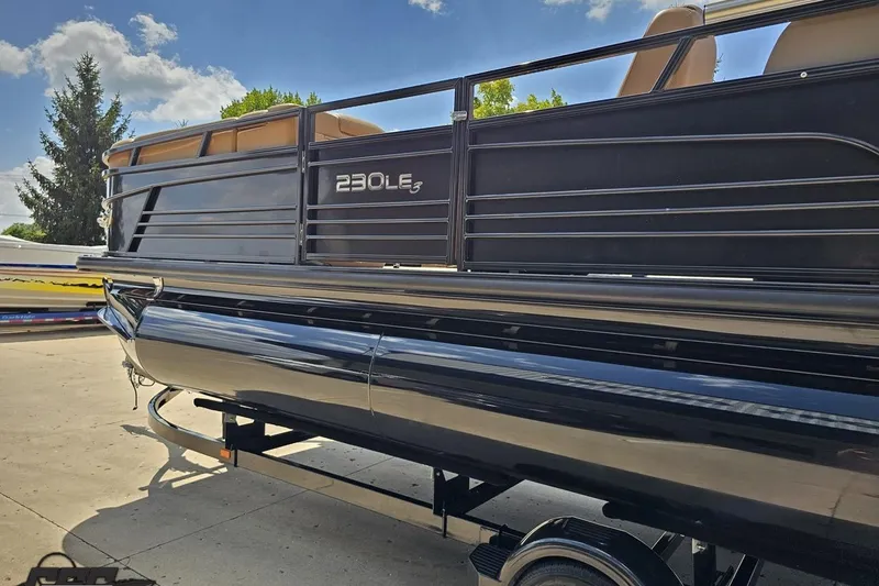 Slide: The Image of 2021 Regency 230 LE3 pontoon boat on trailer, sunny day background. - 36