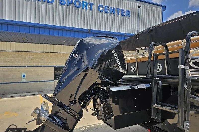 Slide: The Image of 2021 Regency 230 LE3 boat with Mercury outboard motor at a sports center. - 46