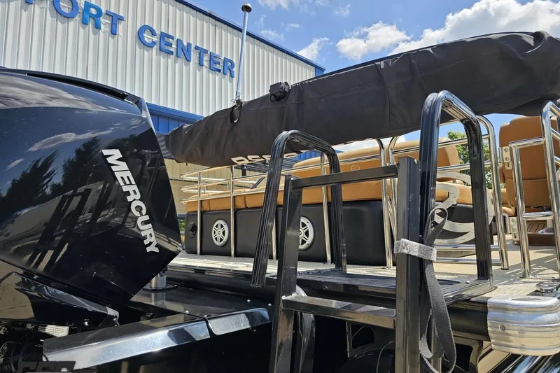 Slide: The Image of 2021 Regency 230 LE3 boat with Mercury engine at a sport center. - 47