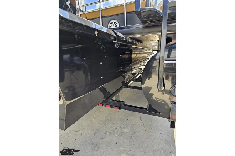 Slide: The Image of 2021 Regency 230 LE3 pontoon boat underside view with trailer attachment. - 50