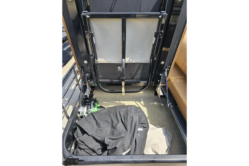 Slide: The Image of Interior view of 2021 Regency 230 LE3 boat storage compartment. - 57