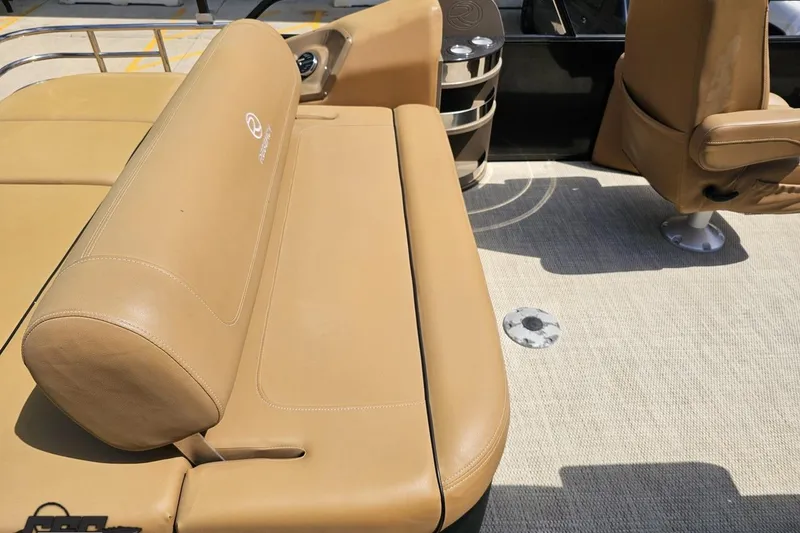 Slide: The Image of Luxurious tan seating on 2021 Regency 230 LE3 boat, showcasing comfort and style. - 59