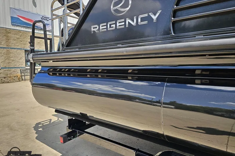 Slide: The Image of 2021 Regency 230 LE3 pontoon boat, sleek design, reflective surface, outdoor setting. - 8
