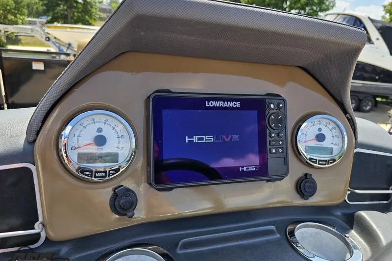 Slide: The Image of Dashboard of 2021 Regency 230 LE3 with Lowrance HDS Live display and gauges. - 83